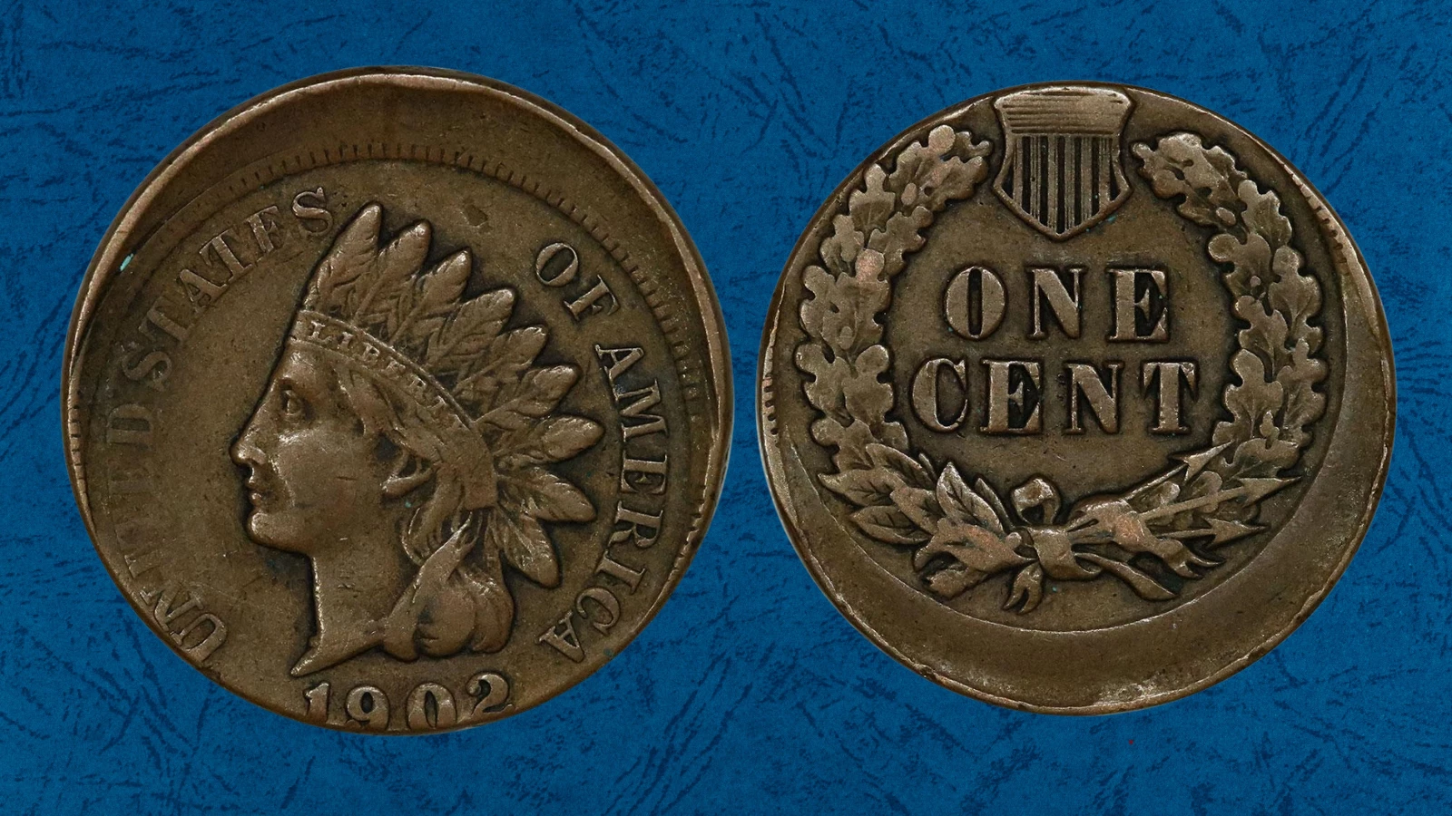 1902 Indian Head Penny off-center strike error showing partial design and blank crescent with date visible